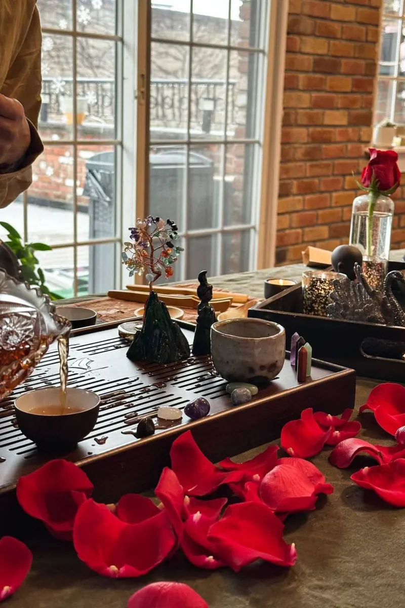 Tea ceremony table with rose petals