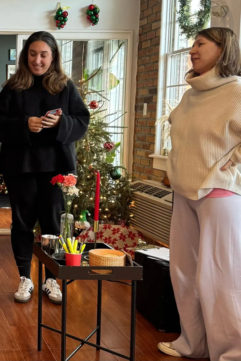 Hosts greeting guests at a workshop