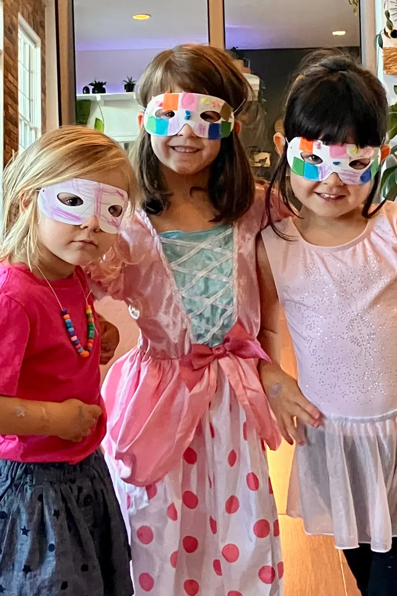Kids wearing party masks