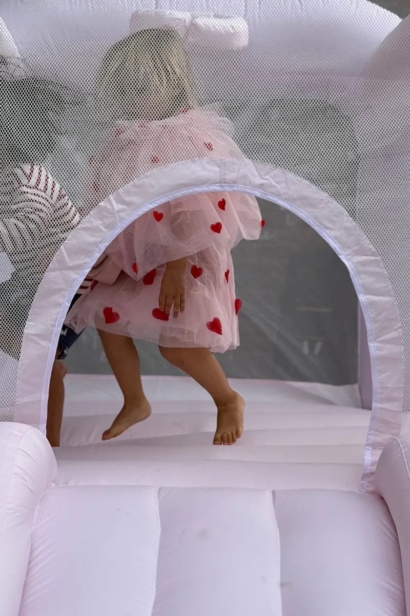 Child jumping in a bouncing house