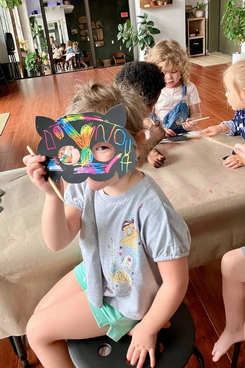 Child wearing a decorated mask