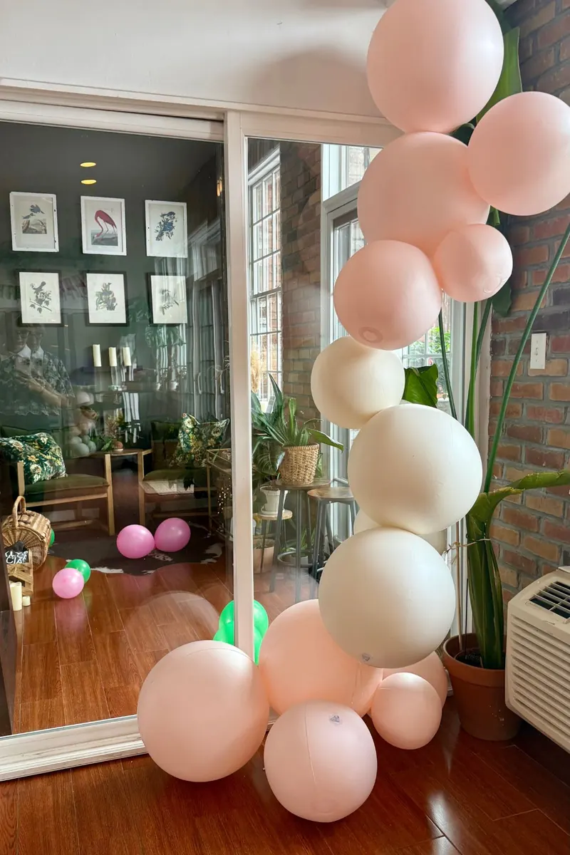 Balloon garland beside framed art